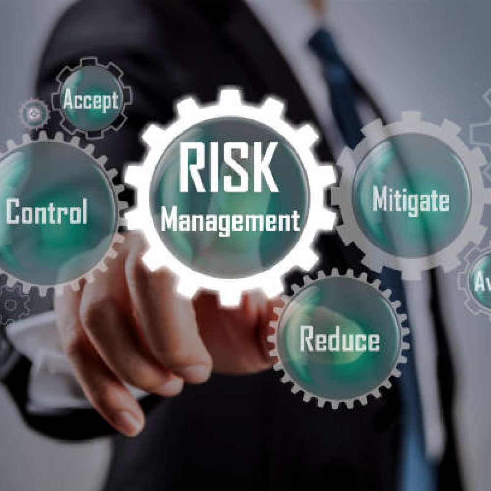 Businessman pointing at risk management concept on screen